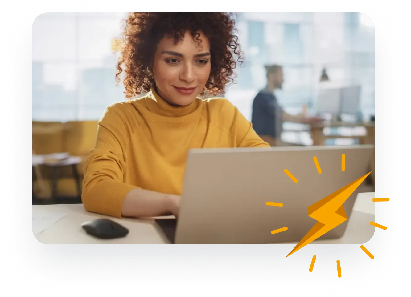 A woman wearing a yellow jumper smiles at her laptop in an office, with a lightning bolt graphic indicating energy and empowerment.